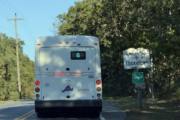 A Route 6 bus at the Edgartown line, by the airport sign