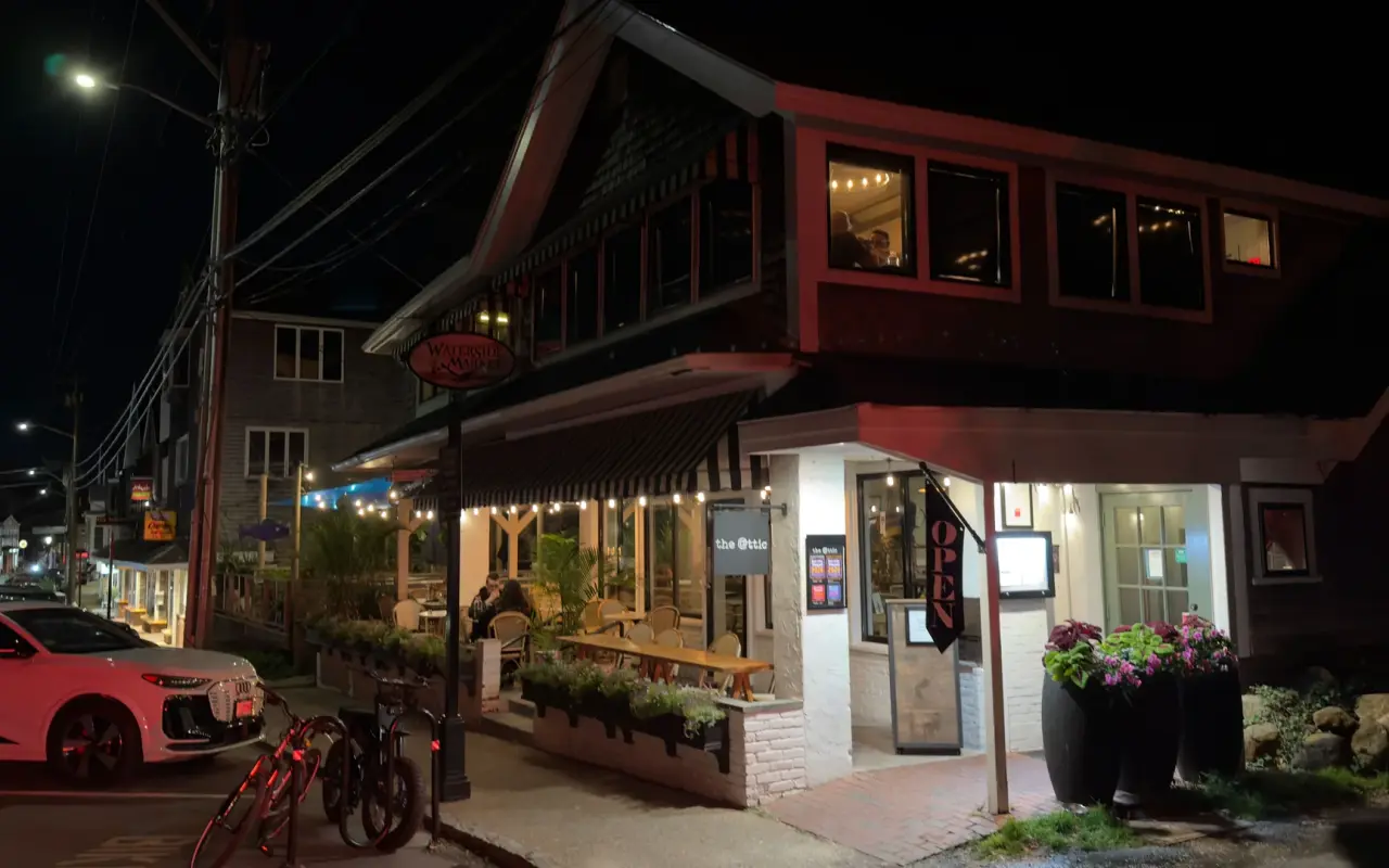 Waterside Market building at night in Vineyard Haven with The Attic bar lit upstairs