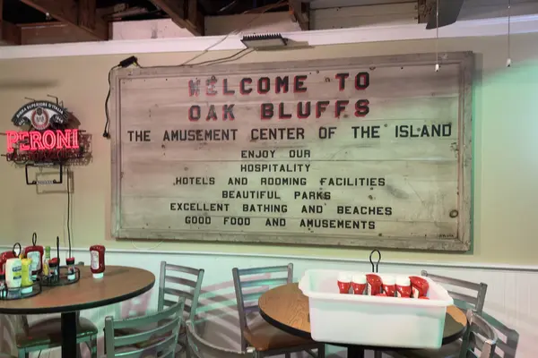 The old Welcome to Oak Bluffs sign, the Amusement Center of the Island, inside the Sand Bar and Grille