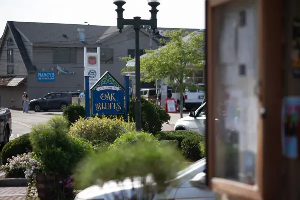 The welcome sign at the edge of town, summer 2026