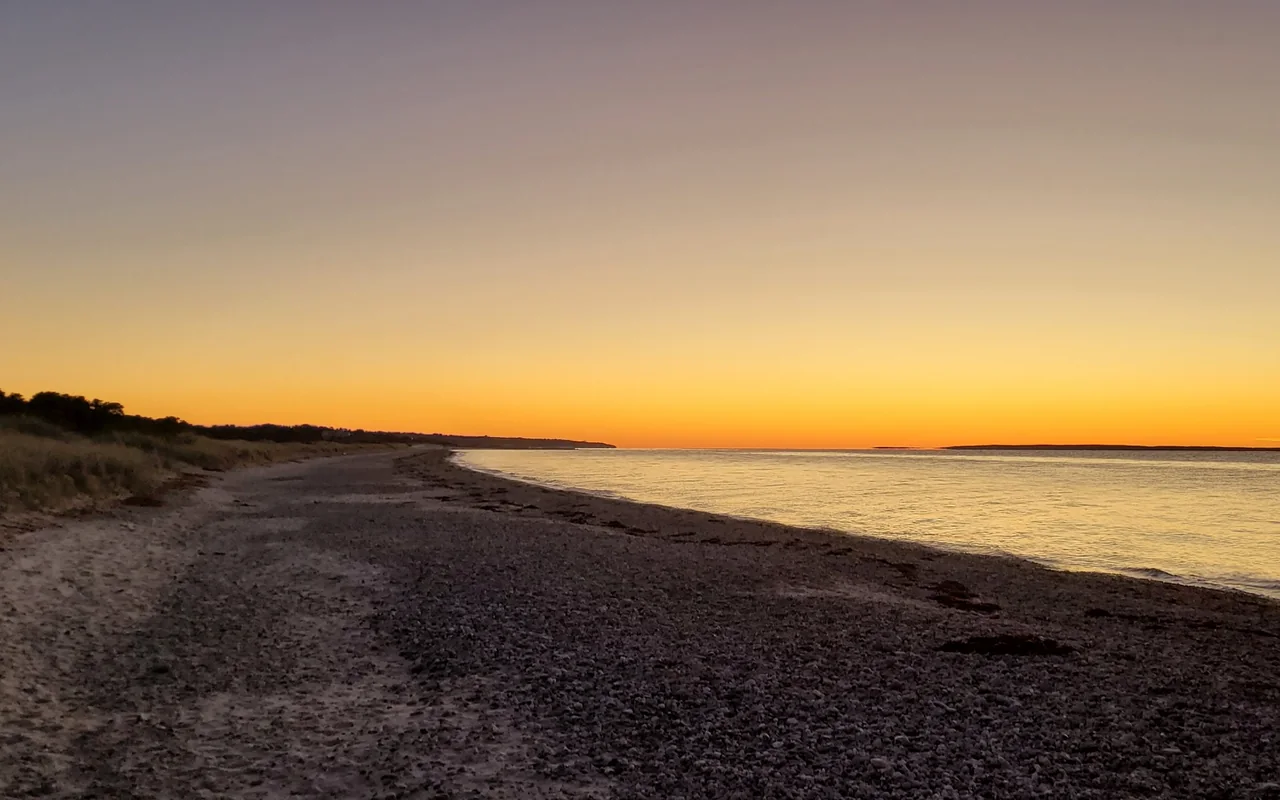The pebbly shore at West Chop in the afterglow