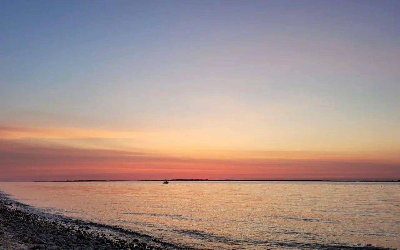 Pastel sunset sky over calm water at West Chop