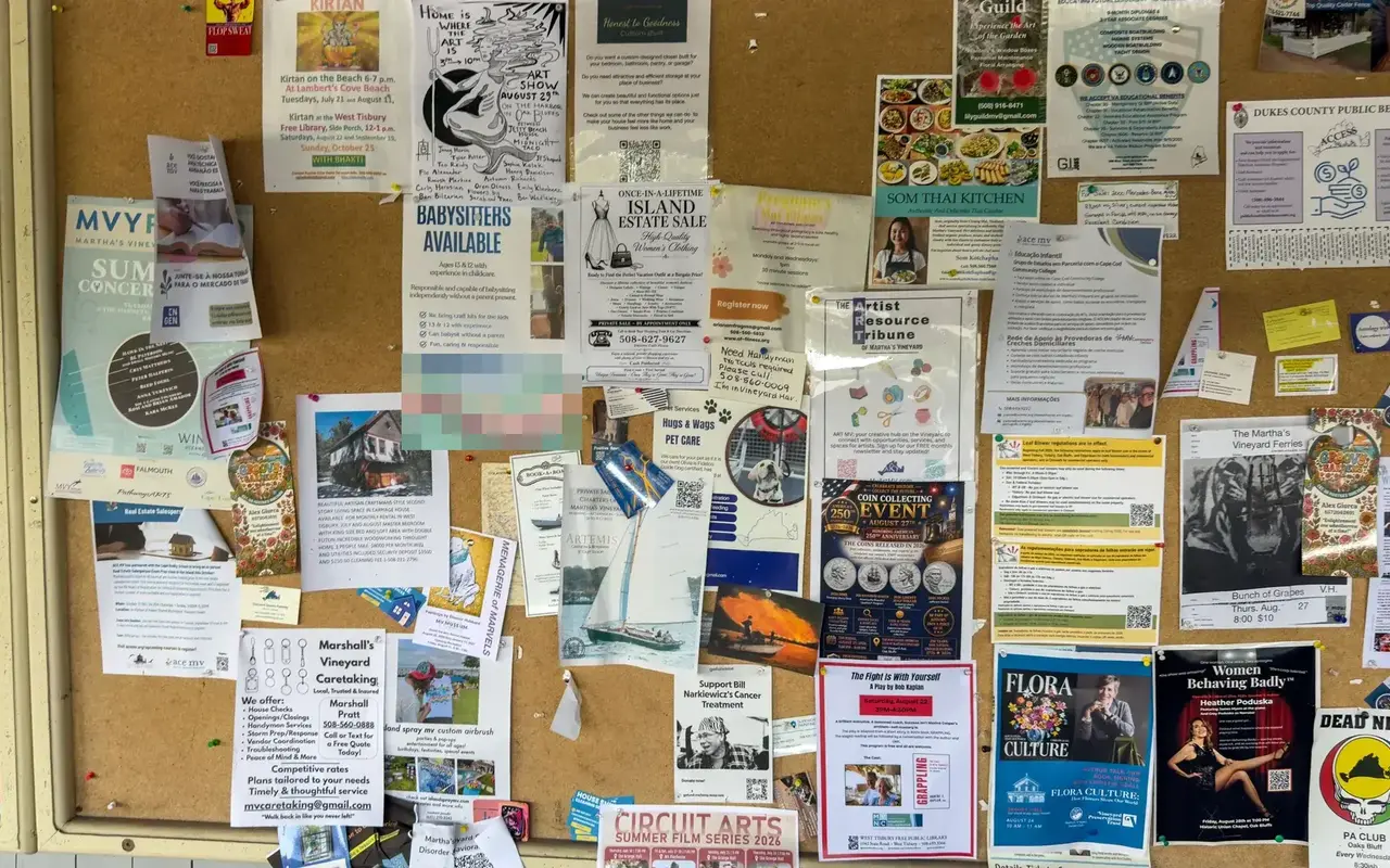 Community bulletin board covered in flyers and posters at Cronig’s Up-Island in West Tisbury