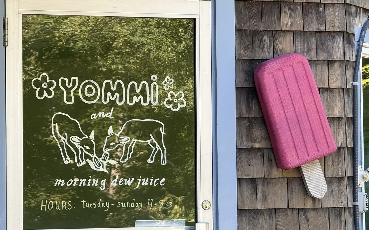 The Yommi and Morning Dew Juice storefront door with a pink popsicle sign on State Road in Vineyard Haven