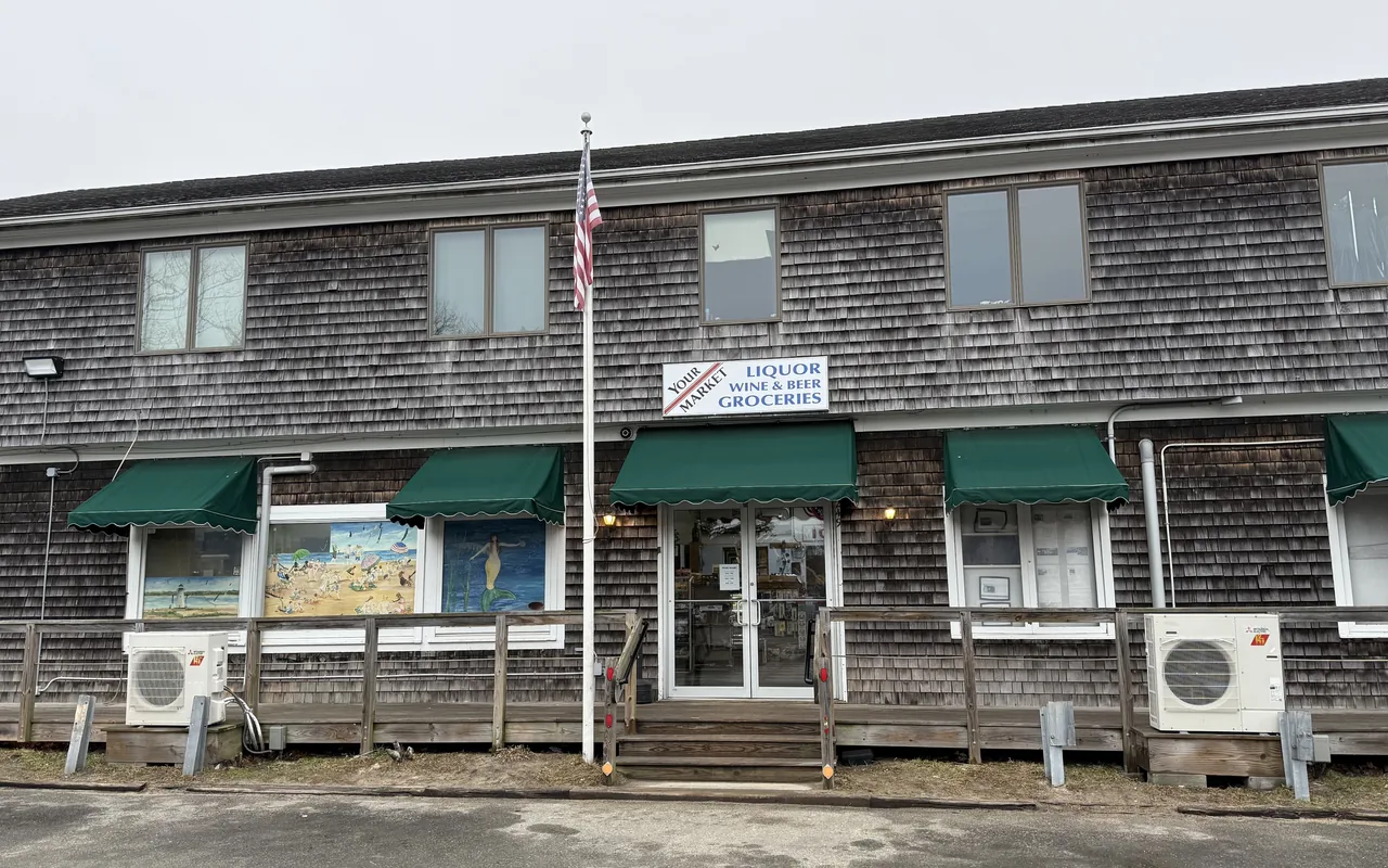 Your Market at the Triangle storefront in Edgartown with green awnings and murals