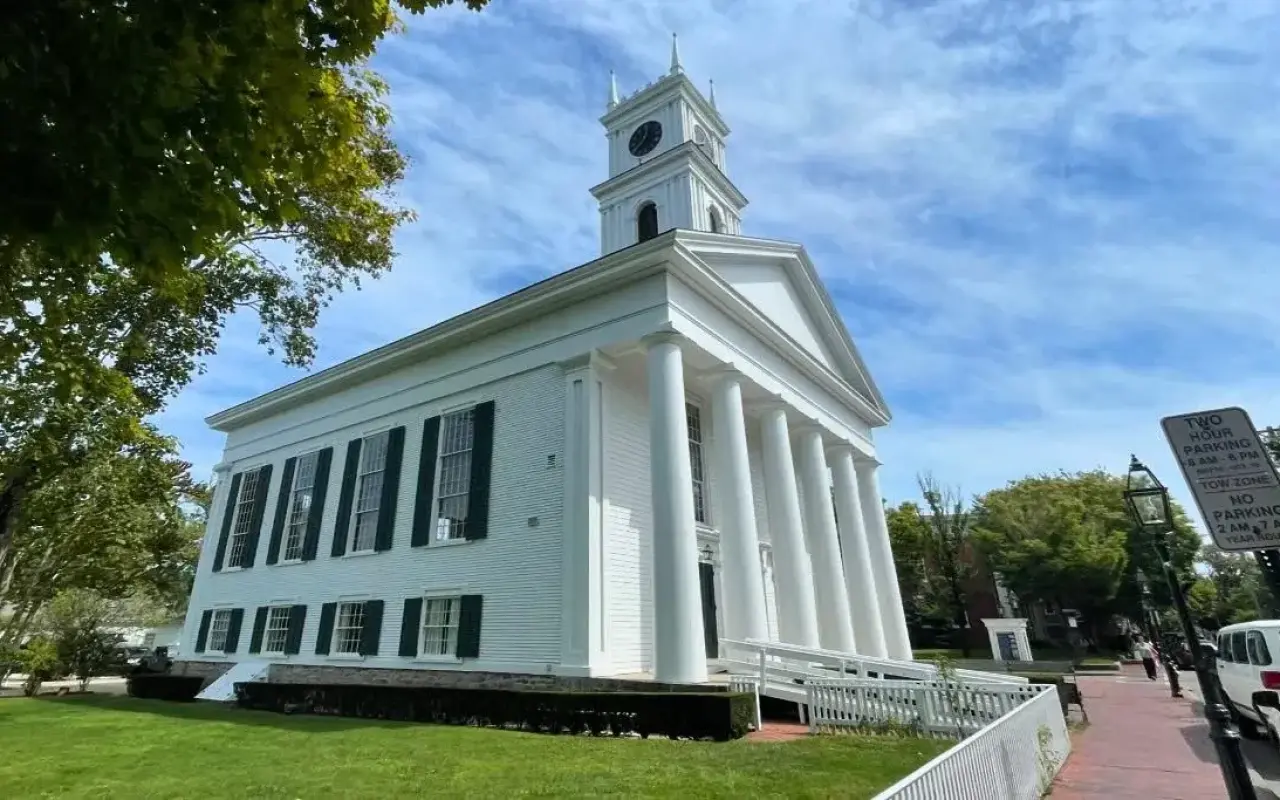 The white Greek Revival front of the Old Whaling Church in Edgartown with its columns and tower