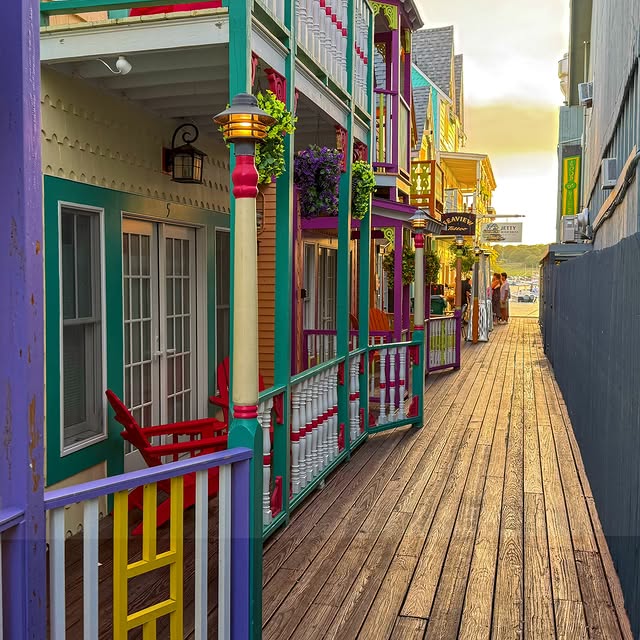 Summer time in Oak Bluffs just hits different, colorful buildings and sunset by the harbor .Visit:...