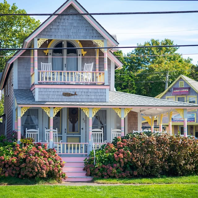 Cottages from 1867 and 1868 sitting side by side in the Oak Bluffs Campground, rockers out on every...