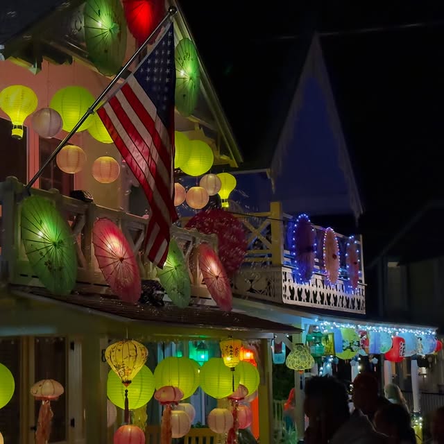 Grand Illumination night in Oak Bluffs. Lanterns hung across every porch in the Campground, and the...