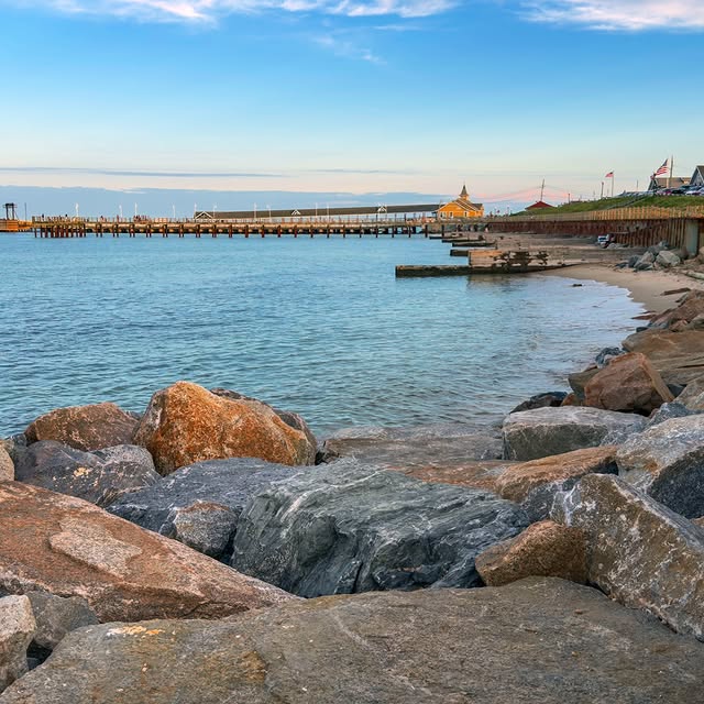 Oak Bluffs, summer day, people fishing off a jetty, Patriot boat in the distance.Visit: https://mvv...