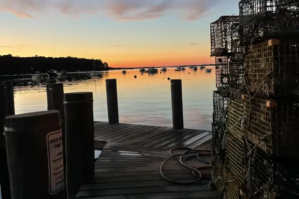 Lobster traps stacked on the dock at Lake Tashmoo at dusk