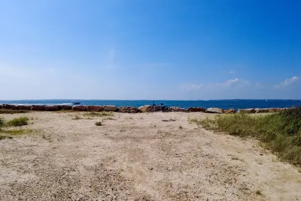 Bike parked on the rocks at a sunny beach