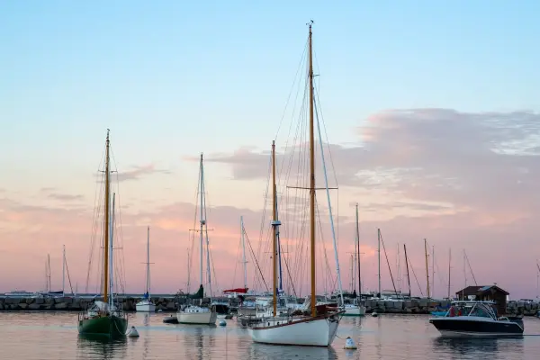 Sailboats at anchor in Vineyard Haven harbor at sunset