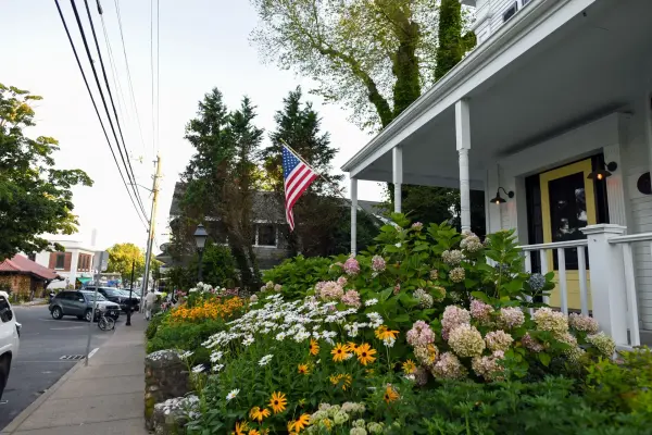Flower garden and American flag outside a Vineyard Haven porch
